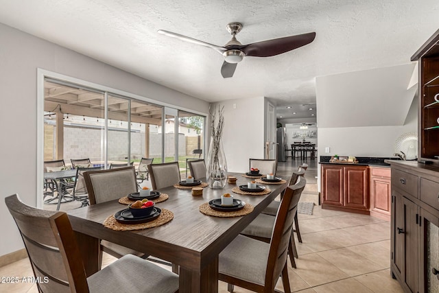 3358 W Sandra Ter, Phoenix, AZ 85053 - dining area with ceiling fan, light tile patterned floors, and a textured ceiling