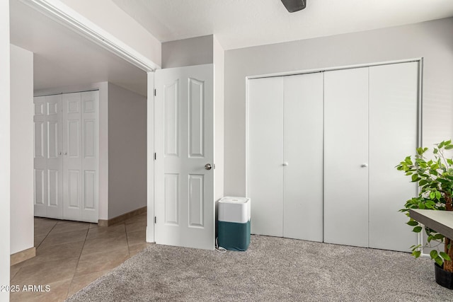 3358 W Sandra Ter, Phoenix, AZ 85053 - unfurnished bedroom with tile patterned floors and baseboards