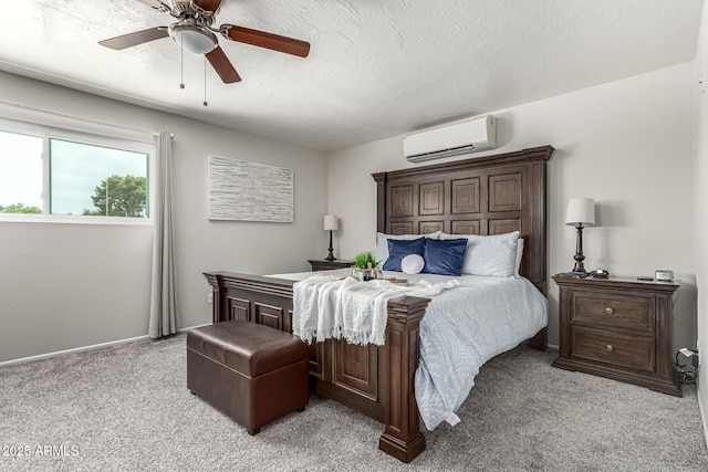 3358 W Sandra Ter, Phoenix, AZ 85053 - bedroom with a wall mounted air conditioner, light carpet, ceiling fan, and baseboards