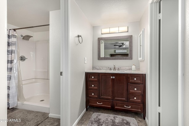 3358 W Sandra Ter, Phoenix, AZ 85053 - bathroom featuring curtained shower, vanity, baseboards, and ceiling fan