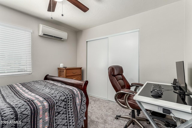 3358 W Sandra Ter, Phoenix, AZ 85053 - bedroom featuring a wall unit AC, carpet floors, a closet, ceiling fan, and an office area