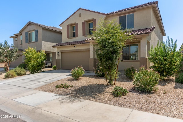 mediterranean / spanish-style house with a garage