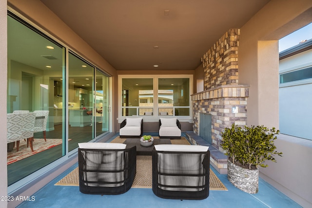 view of patio featuring an outdoor living space with a fireplace