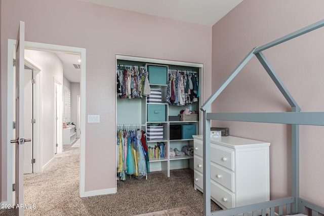 interior space featuring carpet floors, a closet, and visible vents