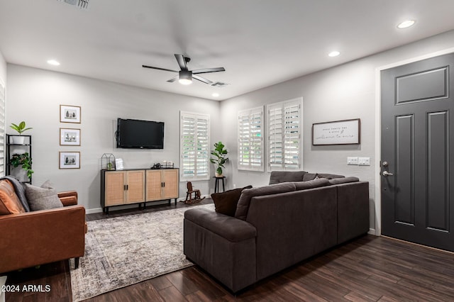 living room with dark wood-style floors, recessed lighting, visible vents, and ceiling fan