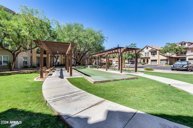 view of home's community with a residential view, a lawn, and a pergola