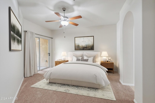 bedroom with ceiling fan, baseboards, and light carpet