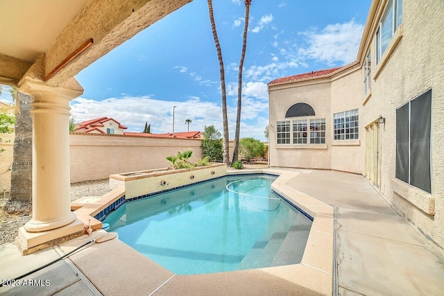 view of swimming pool featuring a patio area