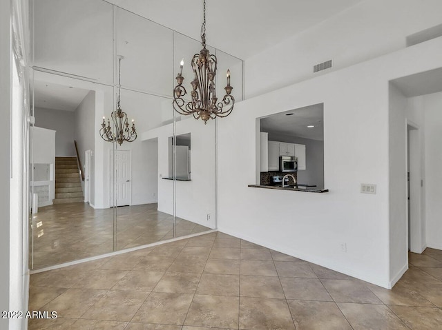 unfurnished dining area with light tile patterned floors