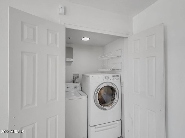 washroom featuring washer and dryer