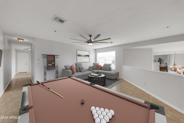 rec room with light tile patterned flooring, billiards, and ceiling fan with notable chandelier