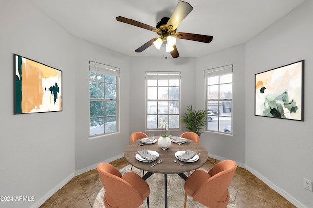 dining room with ceiling fan and light tile patterned floors