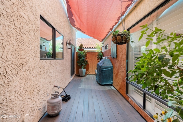 wooden terrace featuring grilling area