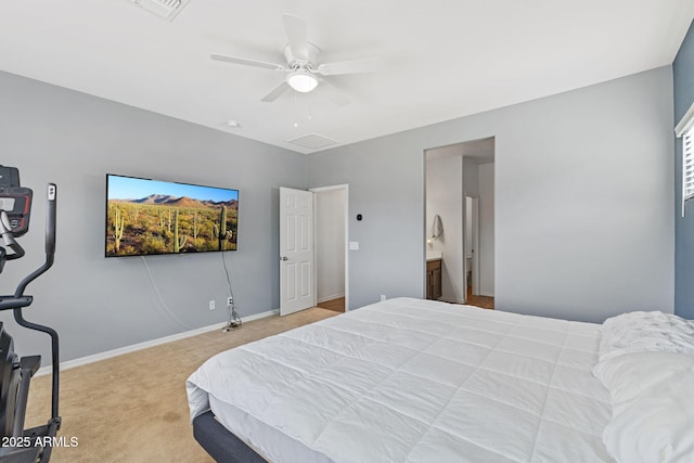 carpeted bedroom featuring connected bathroom and ceiling fan