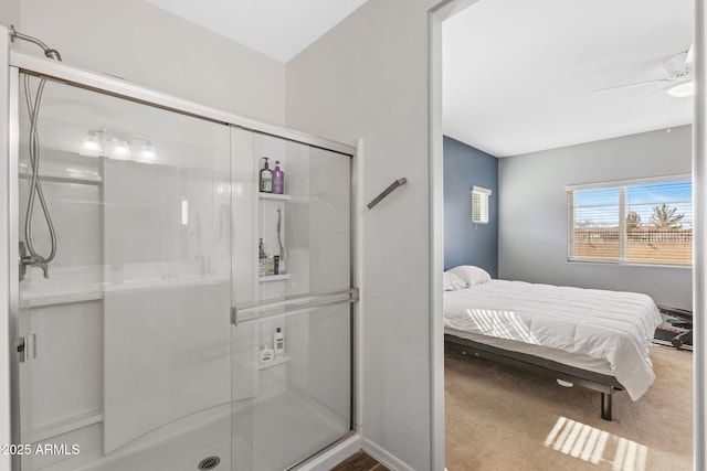 bathroom with an enclosed shower and ceiling fan