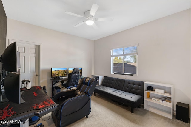 home office featuring light carpet and ceiling fan