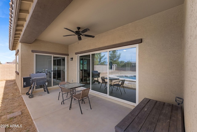 view of patio featuring ceiling fan