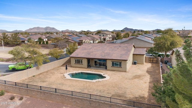 view of pool featuring a mountain view and a patio area