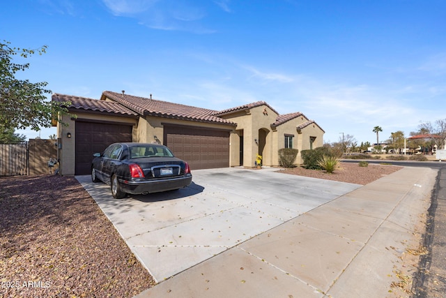 mediterranean / spanish-style home featuring a garage