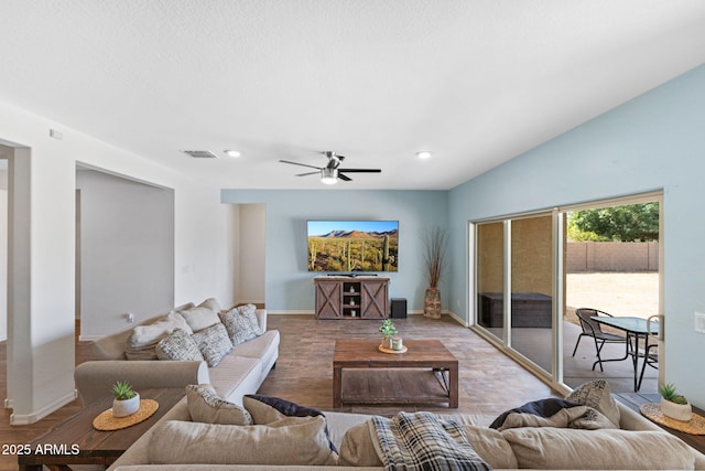 living room with ceiling fan and light wood-type flooring