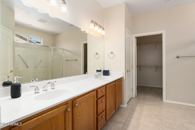 bathroom with vanity, tile patterned floors, and an enclosed shower