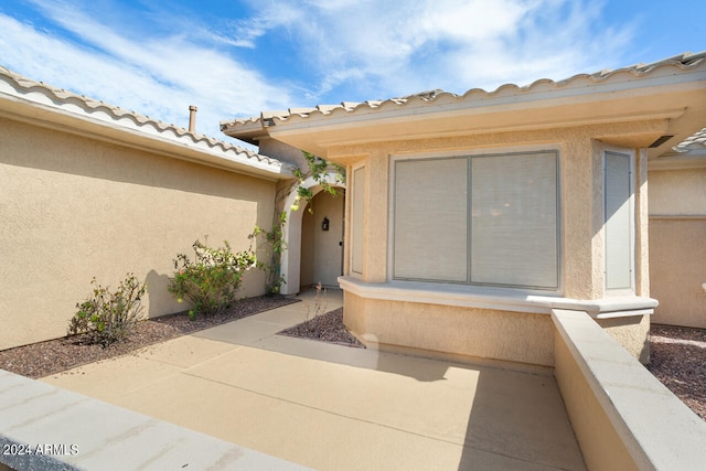 property entrance with a patio