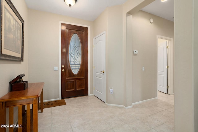 entrance foyer featuring light tile patterned flooring