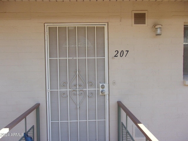 view of exterior entry featuring visible vents