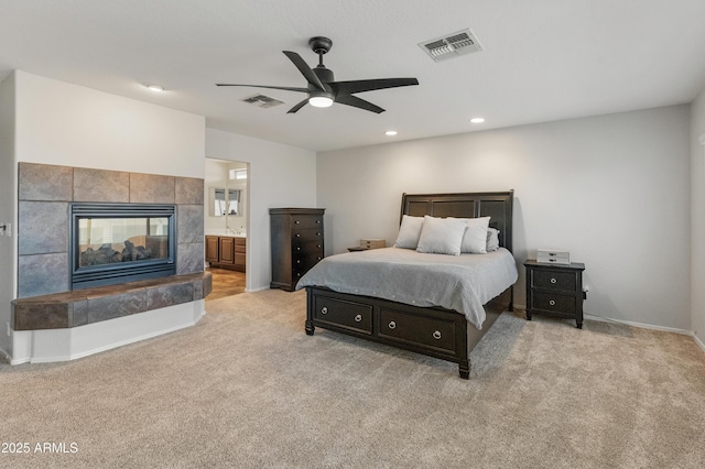 5917 N 133rd Ave, Litchfield Park, AZ 85340 - bedroom featuring recessed lighting, visible vents, carpet flooring, and a tile fireplace