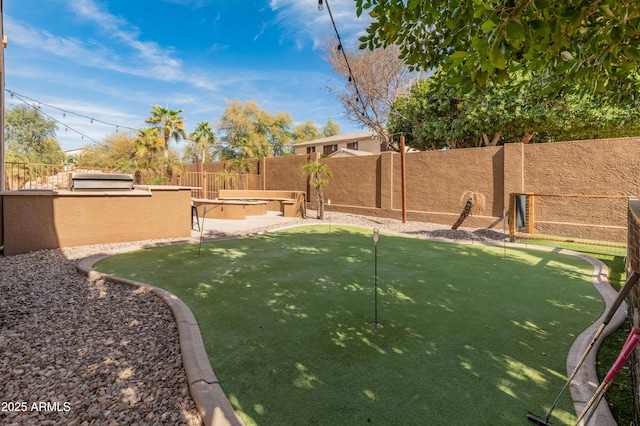 5917 N 133rd Ave, Litchfield Park, AZ 85340 - view of yard featuring a fenced backyard and an outdoor kitchen