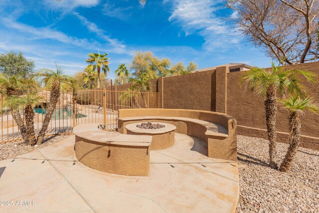5917 N 133rd Ave, Litchfield Park, AZ 85340 - view of patio / terrace featuring a fire pit and a fenced backyard
