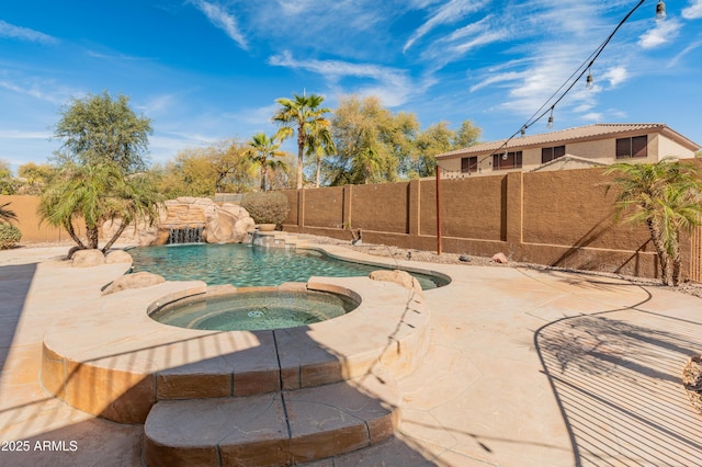 5917 N 133rd Ave, Litchfield Park, AZ 85340 - view of pool with an in ground hot tub, a fenced backyard, a fenced in pool, and a patio area