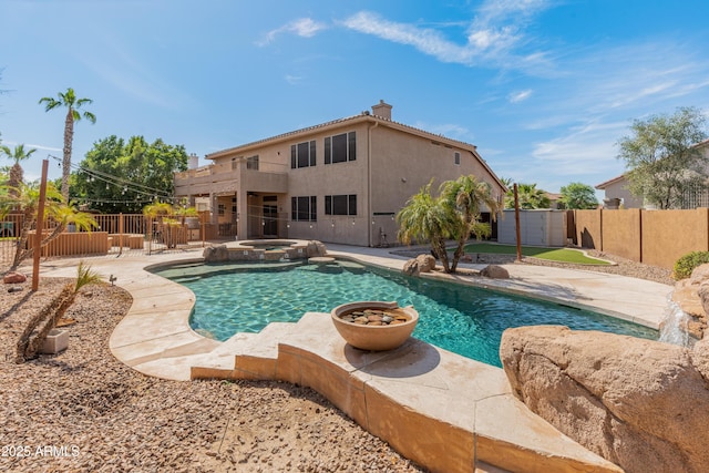 5917 N 133rd Ave, Litchfield Park, AZ 85340 - view of pool featuring a patio area, a pool with connected hot tub, and a fenced backyard