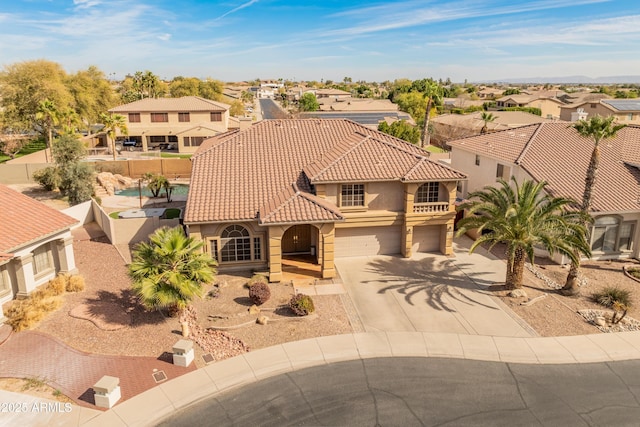 5917 N 133rd Ave, Litchfield Park, AZ 85340 - view of front of property featuring driveway, stucco siding, a garage, a tiled roof, and a residential view