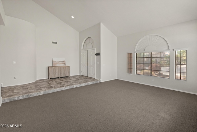 5917 N 133rd Ave, Litchfield Park, AZ 85340 - unfurnished room featuring dark colored carpet, visible vents, baseboards, and high vaulted ceiling