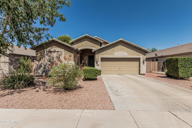 609 S 122nd Dr, Avondale, AZ 85323 - single story home featuring an attached garage, concrete driveway, stucco siding, and a tile roof
