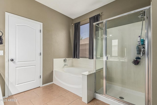 609 S 122nd Dr, Avondale, AZ 85323 - full bath featuring a stall shower, a bath, and tile patterned floors