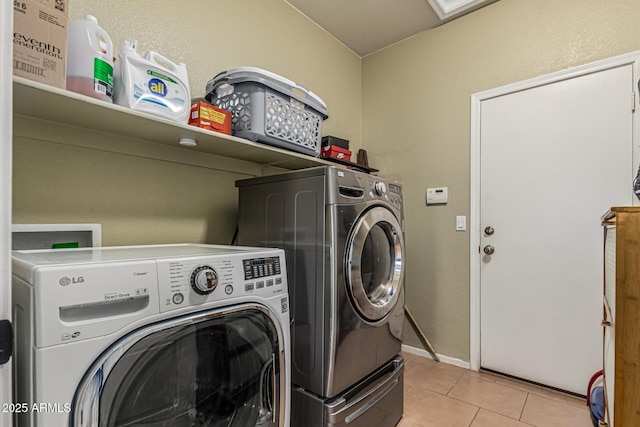 609 S 122nd Dr, Avondale, AZ 85323 - washroom featuring washer and dryer and light tile patterned floors