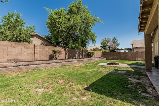 609 S 122nd Dr, Avondale, AZ 85323 - fenced backyard with a fire pit
