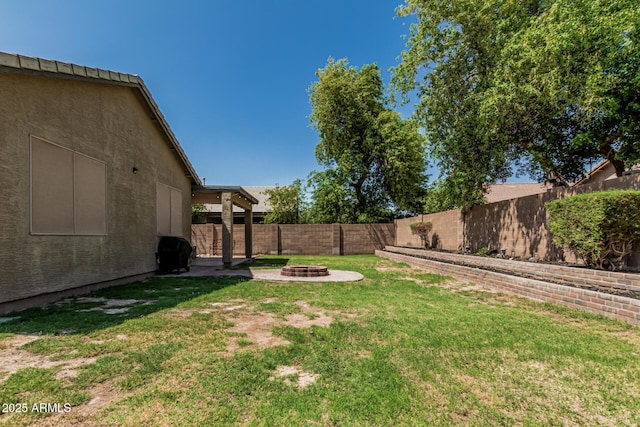 609 S 122nd Dr, Avondale, AZ 85323 - fenced backyard with an outdoor fire pit