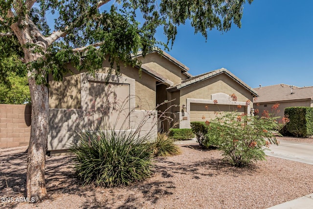 609 S 122nd Dr, Avondale, AZ 85323 - ranch-style home featuring a garage, stucco siding, and driveway