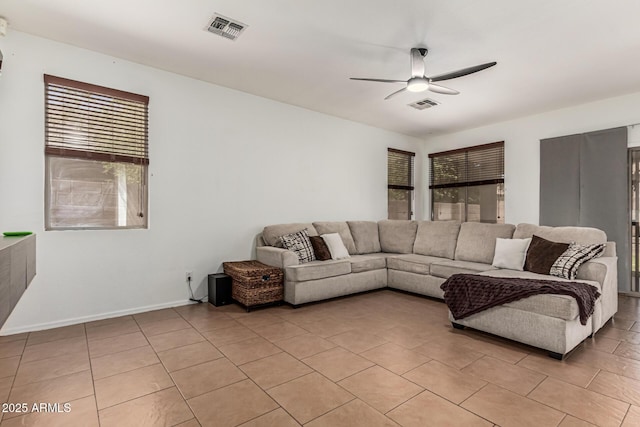 609 S 122nd Dr, Avondale, AZ 85323 - living room with a ceiling fan and light tile patterned flooring