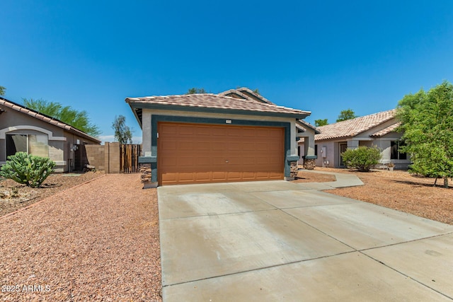 14936 W Maui Ln, Surprise, AZ 85379 - ranch-style home with concrete driveway, stucco siding, an attached garage, and a tile roof