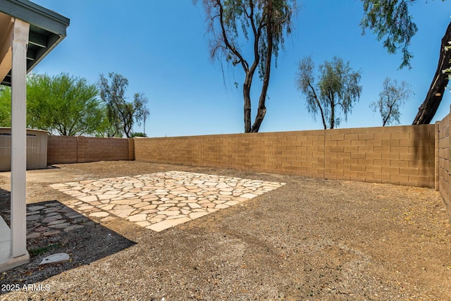 14936 W Maui Ln, Surprise, AZ 85379 - fenced backyard featuring a patio and a storage shed