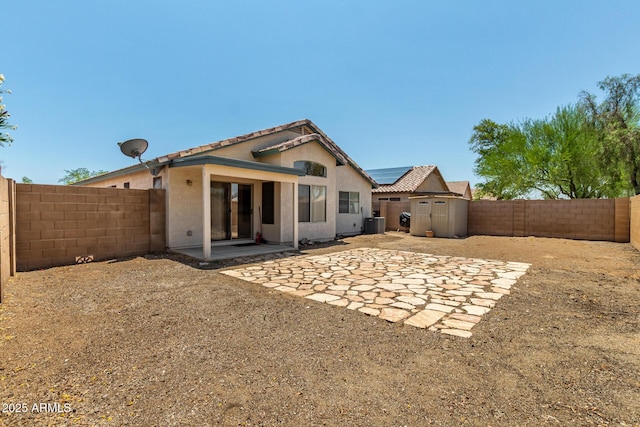 14936 W Maui Ln, Surprise, AZ 85379 - back of property with a fenced backyard, a patio, a storage shed, and stucco siding