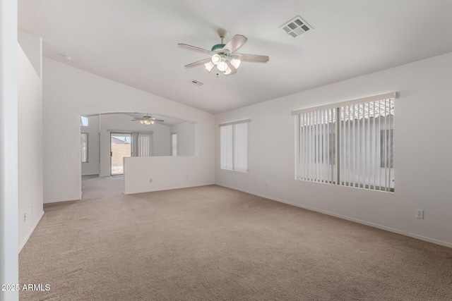 14936 W Maui Ln, Surprise, AZ 85379 - carpeted spare room featuring ceiling fan, vaulted ceiling, and arched walkways