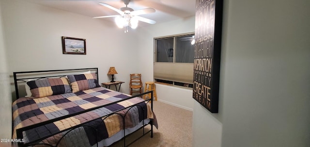 bedroom featuring ceiling fan and light colored carpet