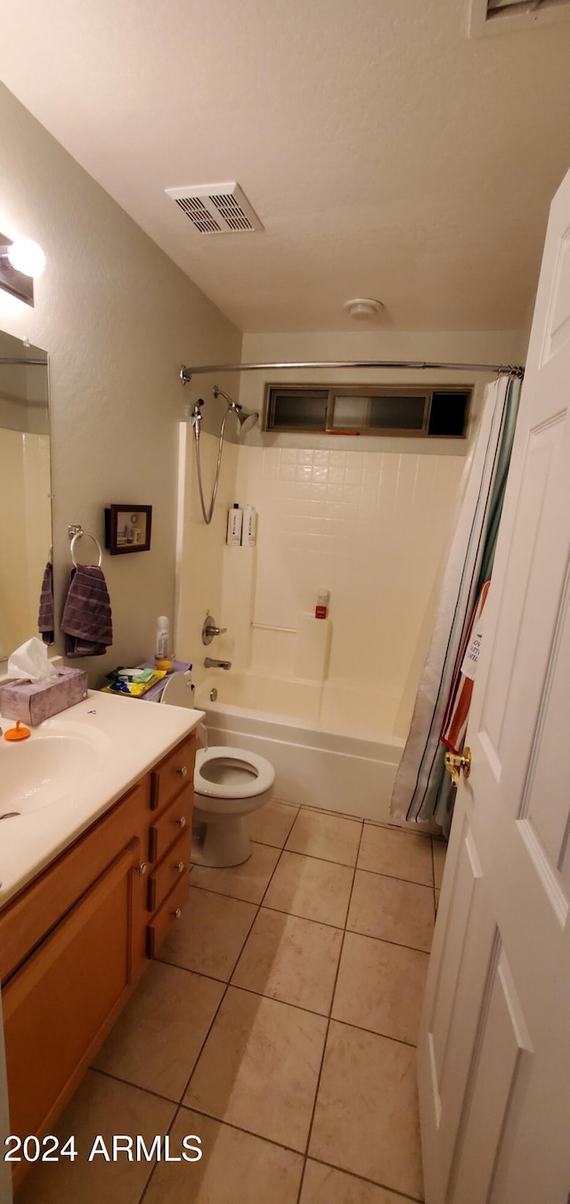 full bathroom with toilet, vanity, tile patterned floors, and shower / bathtub combination with curtain