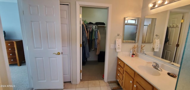 bathroom featuring tile patterned flooring and vanity