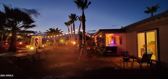 view of patio terrace at dusk